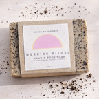 morning ritual hand and body soap scattered coffee grounds on a light background label showcased